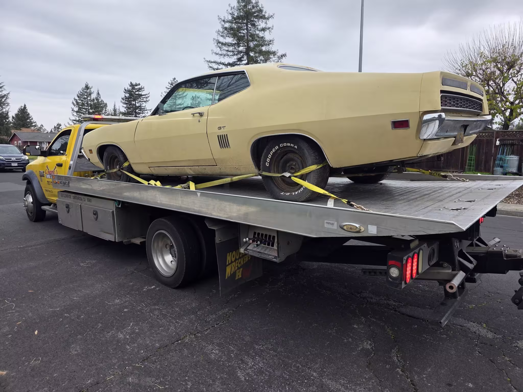 Yellow vintage car on flatbed